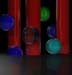Picture of reflective columns and spheres with some transparency.